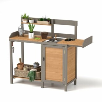 Wooden garden potting bench with plants and tools