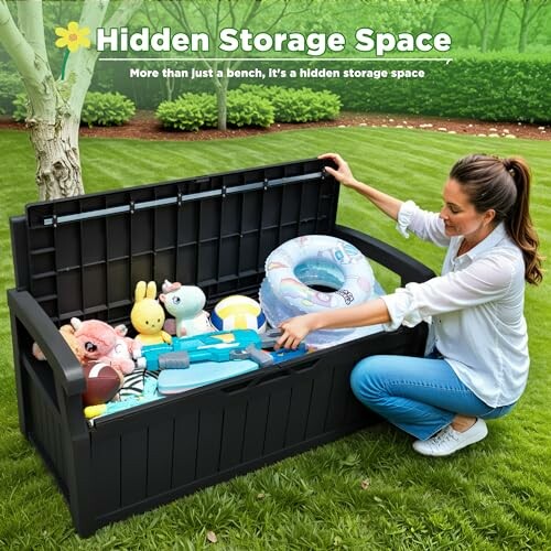 Woman organizing toys in outdoor storage bench on grass.