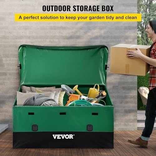 Green outdoor storage box with various garden tools and a person holding a box.