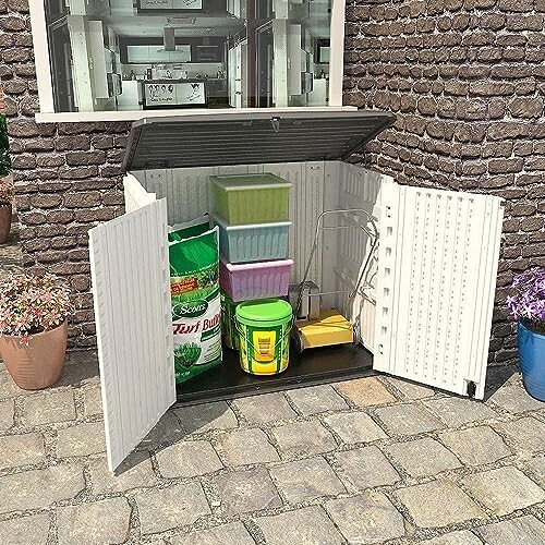 Outdoor storage shed with gardening supplies and containers.