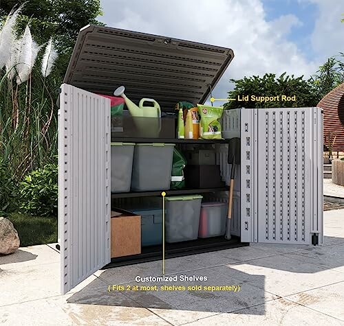 Outdoor storage shed with open doors showing shelves and gardening tools.