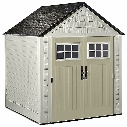 Outdoor storage shed with double doors and shingled roof