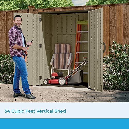 Man with tools in front of open vertical storage shed containing a lawnmower and ladder.